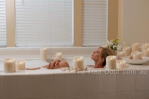 This lady chooses not to use traditional candles for her relaxing bath. Amazing isn't it?